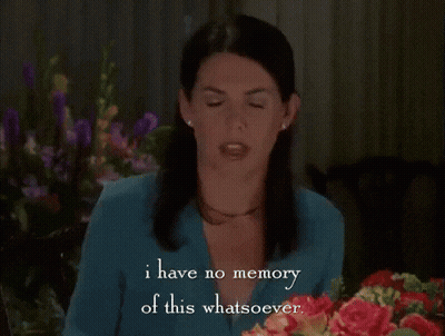 Woman Sitting In Front Of Bouquet Says I Have No Memory Of This Whatsoever GIF