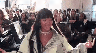 Woman Sitting In Front Of Crowd GIF