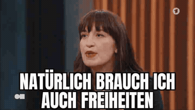 Woman Sitting in Front of Curtain Saying Naturlich Brauche Ich Auch Freiheiten