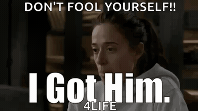 Woman Sitting In Front Of Don't Fool Yourself Sign GIF