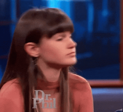 Woman Sitting In Front Of Dr Phil Logo GIF