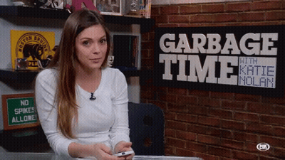 Woman Sitting In Front Of Garbage Time Sign GIF