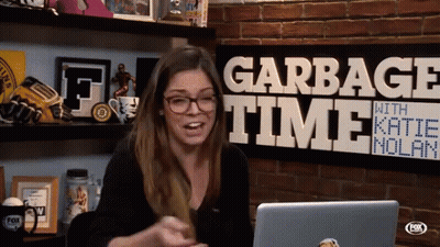 Woman Sitting In Front Of Garbage Time With Katie Nolan Sign GIF