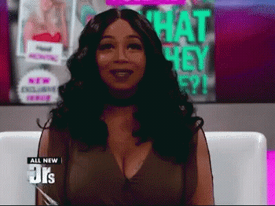 Woman Sitting In Front Of Hey Poster GIF