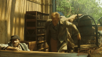 Woman Sitting In Front Of Jungle Cruise Sign GIF