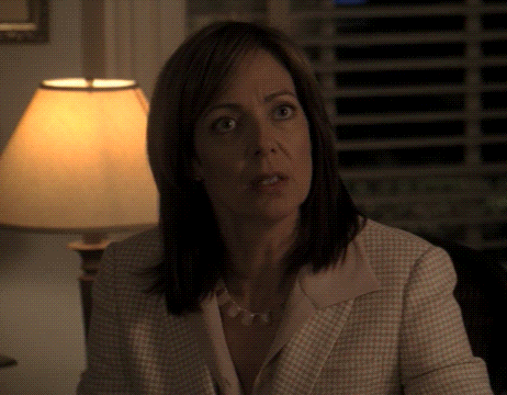 Woman Sitting In Front Of Lamp Looking At Something GIF