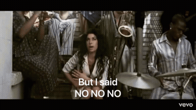 Woman Sitting In Front Of Man Playing Drums Saying But I Said No No No GIF