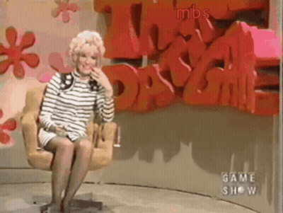 Woman Sitting In Front Of MBS Wall GIF
