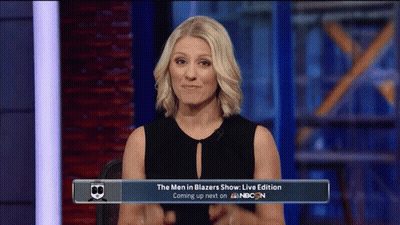 Woman Sitting In Front Of Men In Blazers Sign GIF