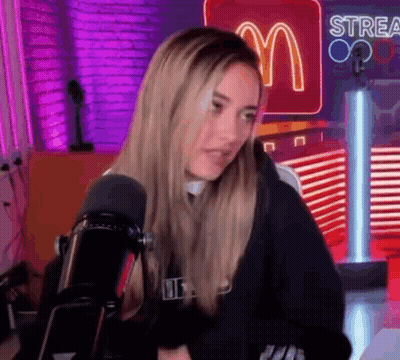 Woman Sitting In Front Of Microphone GIF