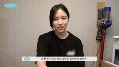 Woman Sitting In Front Of Mina TV Vacuum GIF