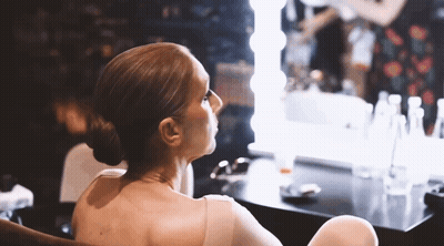 Woman Sitting In Front Of Mirror GIF