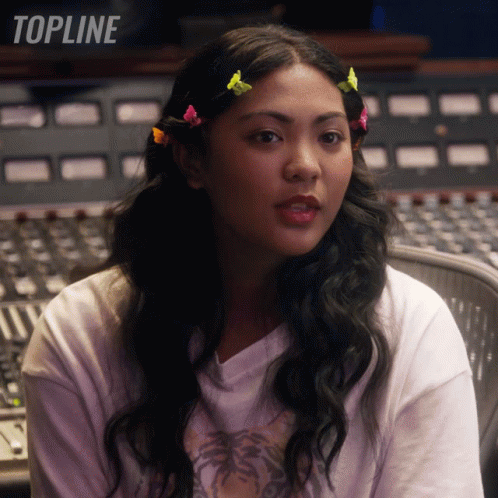 Woman Sitting In Front Of Mixer With Word Topline GIF