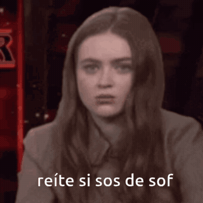 Woman Sitting in Front of Reitere Si Sos De Sof Sign