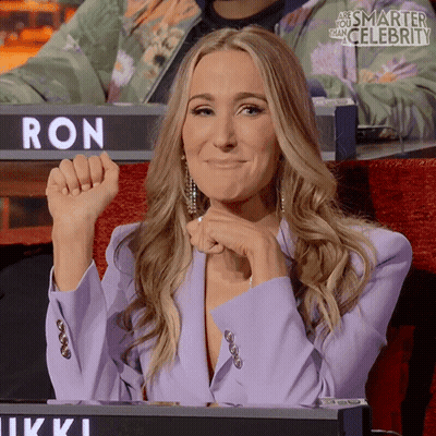 Woman Sitting In Front Of Ron Sign GIF