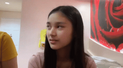 Woman Sitting In Front Of Rose Picture GIF