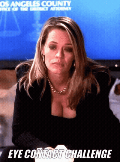 Woman Sitting In Front Of Screen Saying Los Angeles County Office Of The District Attorney GIF