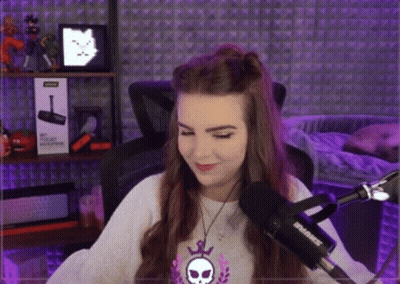 Woman Sitting In Front Of Shure Microphone In Purple Room GIF