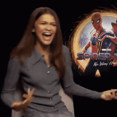 Woman Sitting In Front Of Spider-Man No Way Home Poster GIF