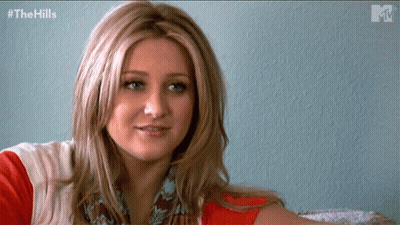 Woman Sitting In Front Of The Hills Wall GIF