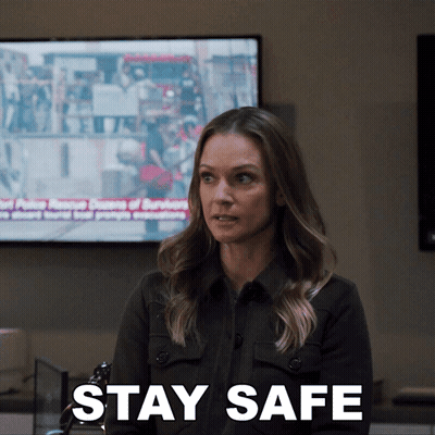 Woman Sitting In Front Of TV Saying Stay Safe GIF