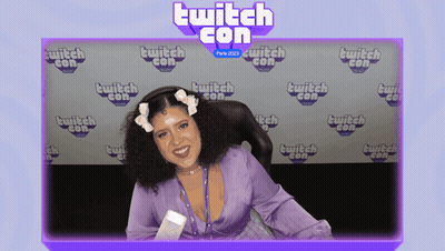 Woman Sitting In Front Of Twitch Con Background GIF