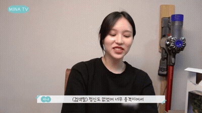 Woman Sitting In Front Of Vacuum Cleaner GIF