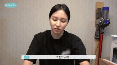 Woman Sitting In Front Of Vacuum Cleaner GIF