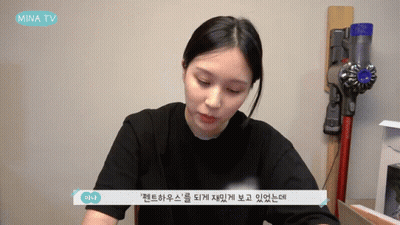 Woman Sitting In Front Of Vacuum GIF