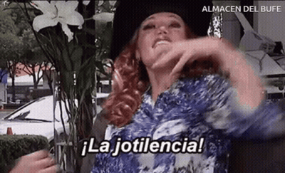 Woman Sitting In Front Of Vase Saying La Jotilencia GIF