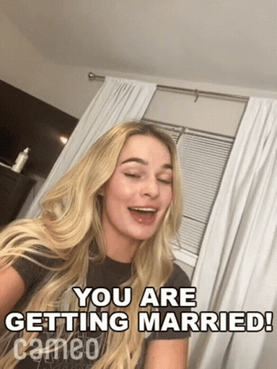 Woman Sitting In Front Of Window Saying You Are Getting Married GIF