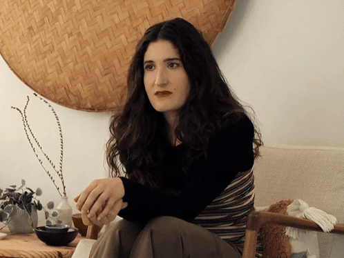 Woman Sitting In Front Of Woven Basket GIF