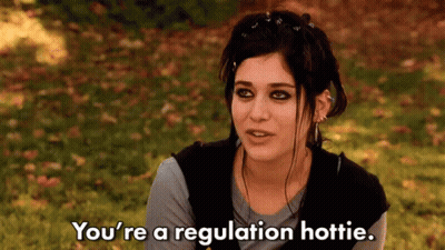Woman Sitting In Grass Saying You're A Regulation Hottie GIF
