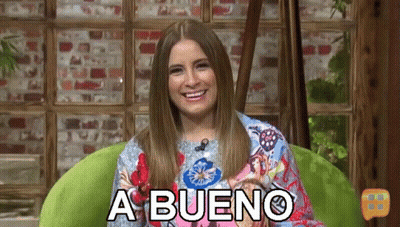 Woman Sitting In Green Chair Smiling A Bueno GIF