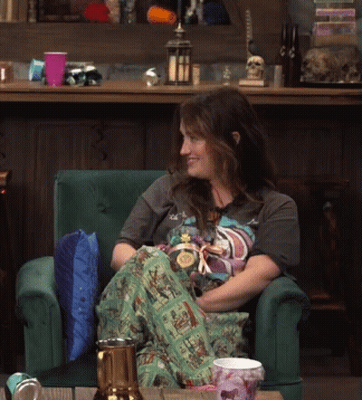 Woman Sitting In Green Chair With Beer GIF