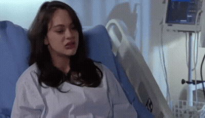 Woman Sitting In Hospital Bed With Monitor On Chest GIF