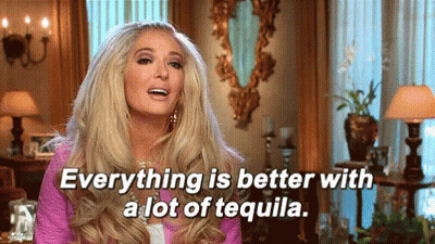 Woman Sitting In Living Room With Tequila GIF