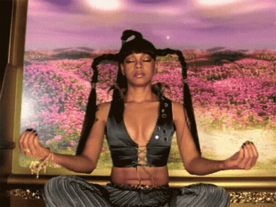 Woman Sitting In Lotus Position With Eyes Closed GIF