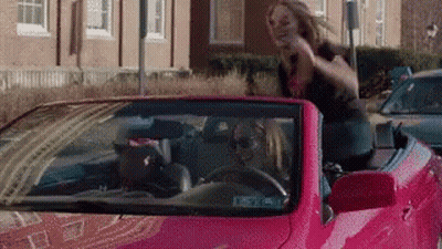 Woman Sitting In Pink Convertible With Head Out Window GIF