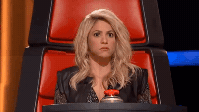 Woman Sitting In Red Chair Holding Button GIF