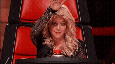 Woman Sitting In Red Chair Waving GIF