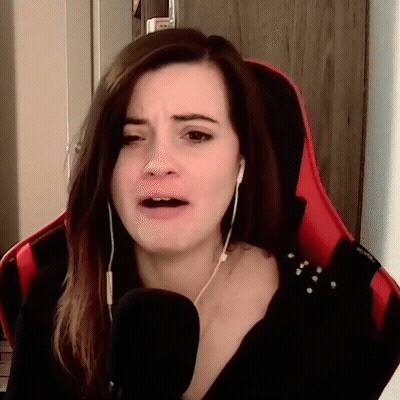 Woman Sitting In Red Chair With Microphone And Headphones GIF