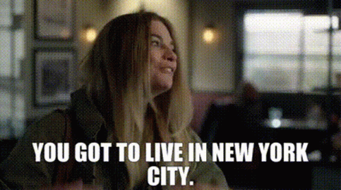 Woman Sitting In Restaurant With NYC Quote GIF