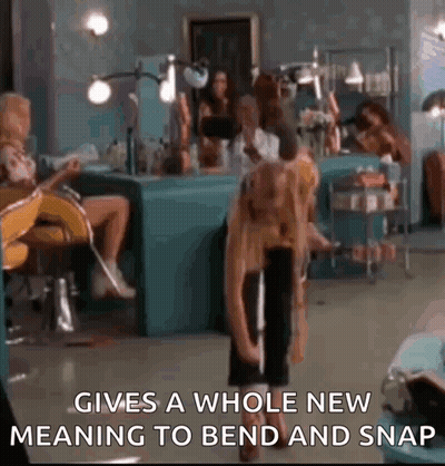 Woman Sitting In Salon With Standing Woman GIF