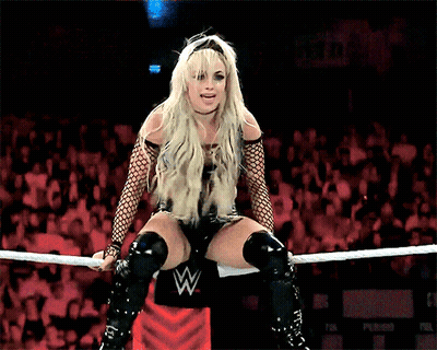 Woman Sitting In Wrestling Ring With W Logo GIF