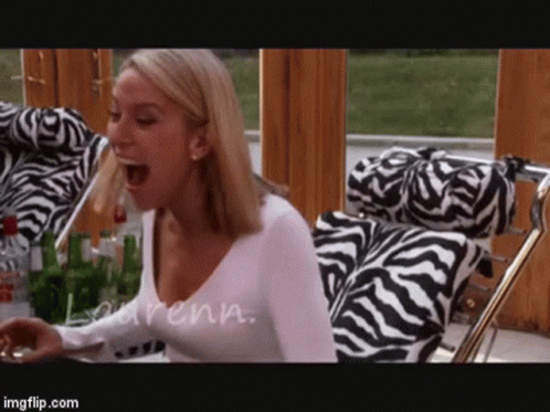 Woman Sitting In Zebra Print Chair GIF