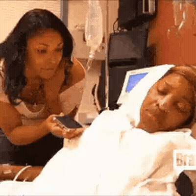 Woman Sitting Next To Hospital Bed GIF