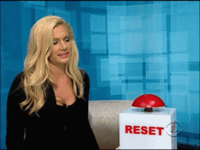 Woman Sitting Next To Reset Box GIF