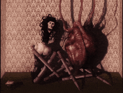 Woman Sitting Next To Spider GIF