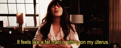 Woman Sitting On Bed Feeling Pressure GIF